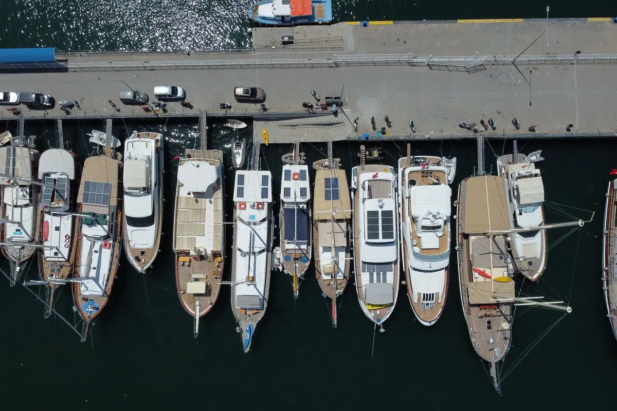 Aerial view of boats moored in rows at a marina, illustrating marine twin-bank battery systems