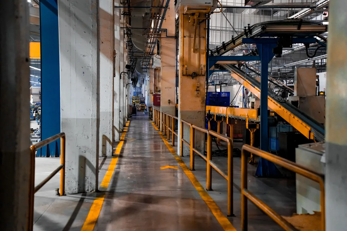 Industrial production line inside a manufacturing facility for vehicle assembly integration